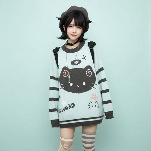 Woman wearing a pastel blue kawaii cat sweater for women with black cat face design and striped sleeves