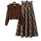 Plaid skirt two-piece winter set featuring a brown knit sweater and a long plaid skirt