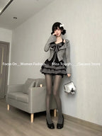 Vintage Womens Kawaii 3-Piece Dress Set with Cardigan and Corset styled with black tights and heels