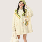 Cute lolita knitted sweater coat with embroidery in cream color featuring green accents and whimsical designs