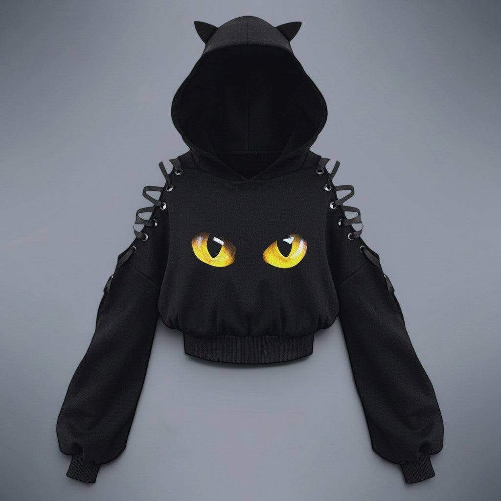Vusy Kawaii Shop Official black hoodie with cat ears, yellow cat eyes graphic, and lace-up shoulder details. Long sleeves, drawstring hood.