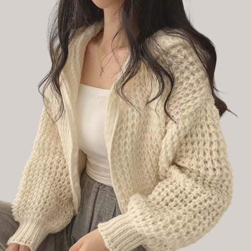 Vusy Kawaii Shop Official cream knit zip-up hoodie with textured sleeves and drawstring hood. Model wears white tube top and grey sweatpants.