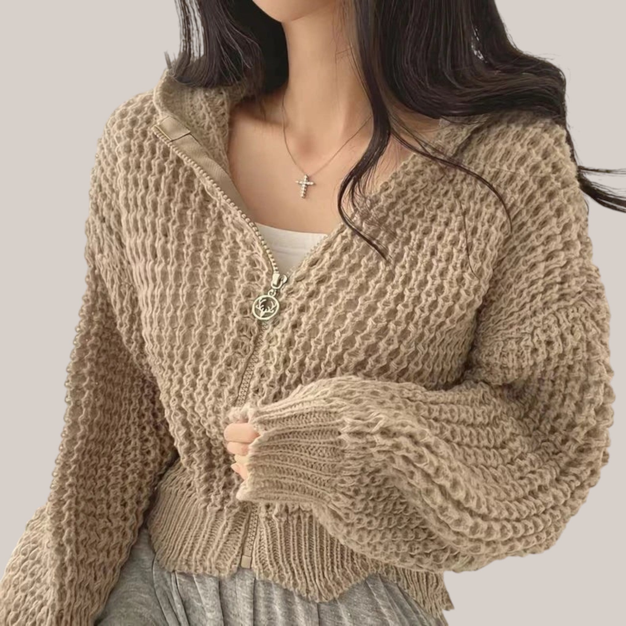 Vusy Kawaii Shop Official beige knit zip-up hoodie with a waffle texture and drawstring hood. Model wears it open over a white top.