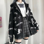 Vusy Kawaii Shop Official black hooded zip-up sweatshirt with all-over cartoon bear and scissors print. Features a white collared shirt and grey bow tie.