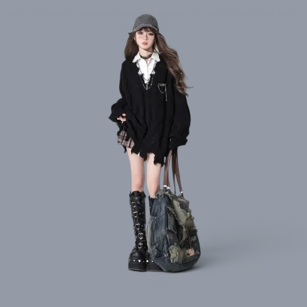 Vusy Kawaii Shop Official black distressed V-neck acrylic knit sweater worn by a young woman with a plaid skirt and platform boots.
