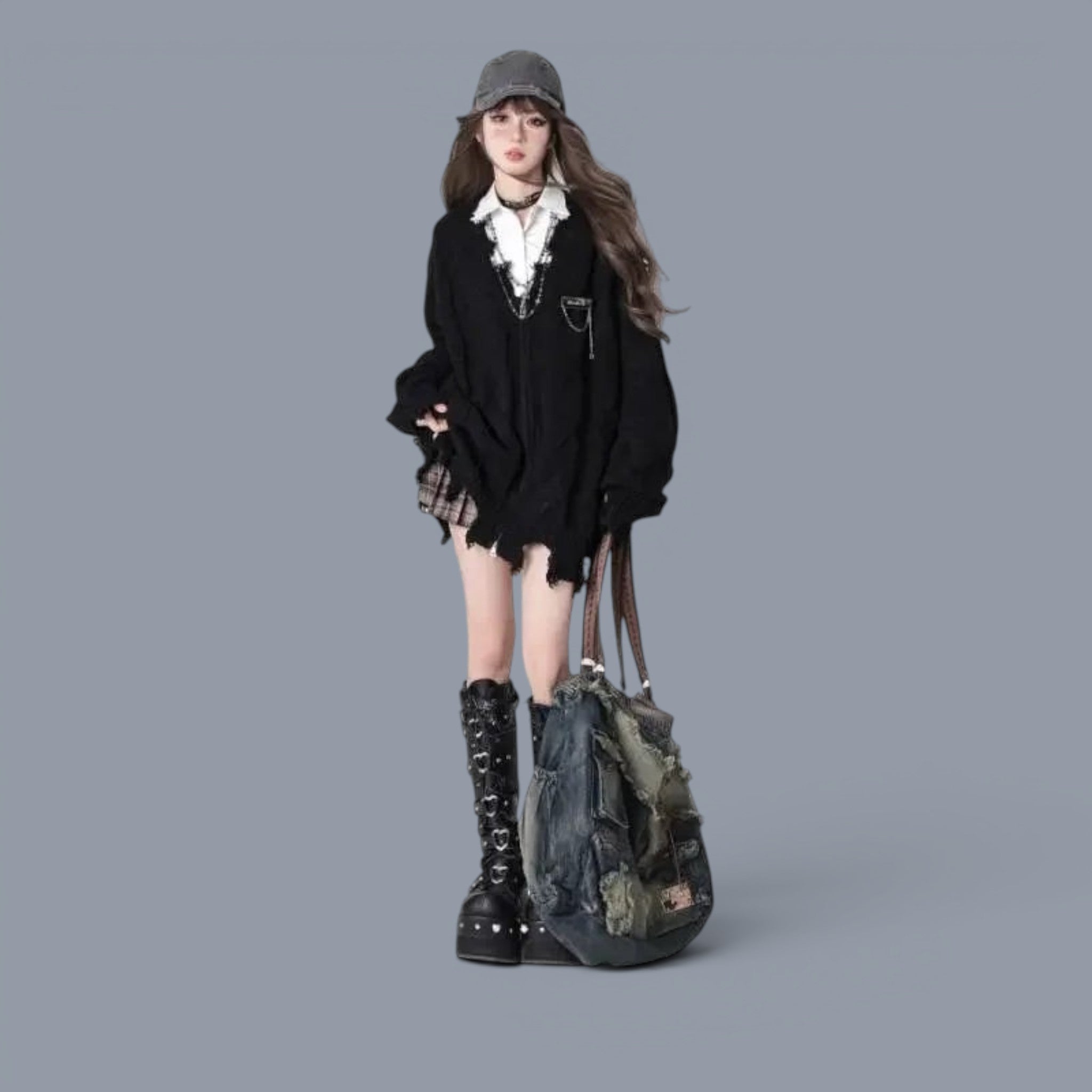 Vusy Kawaii Shop Official black distressed V-neck acrylic knit sweater worn by a young woman with a plaid skirt and platform boots.