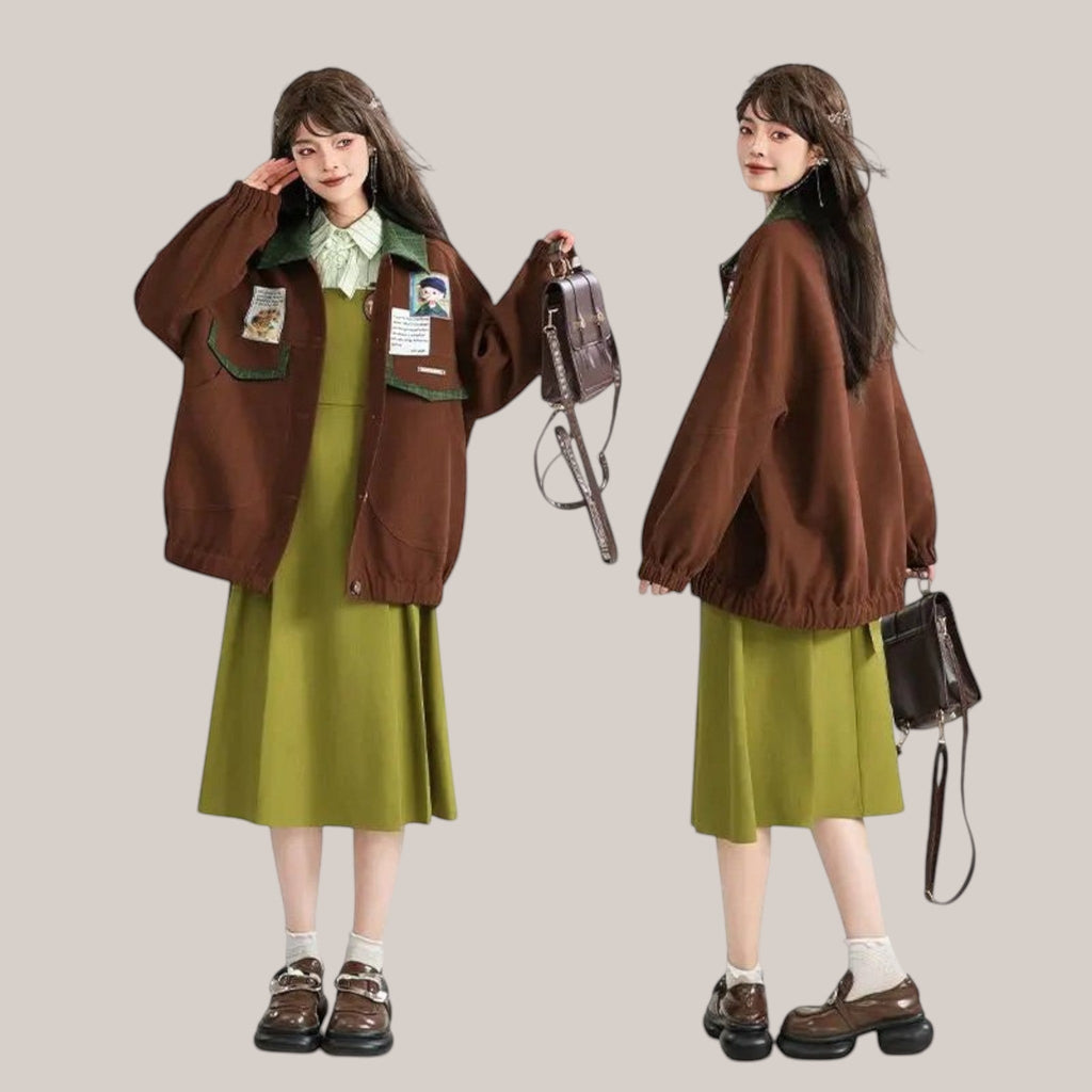 Vusy Kawaii Shop Official brown polyester-cotton blend bomber jacket with green collar and patches, worn by a model with a green dress.