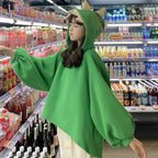 Vusy Kawaii Shop Official green oversized hoodie with dinosaur spikes on the hood, made from a cotton-polyester blend.