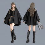 Vusy Kawaii Shop Official black loose long sleeve top with lace back detail, worn by a model with a tie and denim skirt.