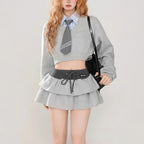 Vusy Kawaii Shop Official grey two-piece set with a cropped sweatshirt, collared shirt, and tie, paired with a ruffled mini skirt.