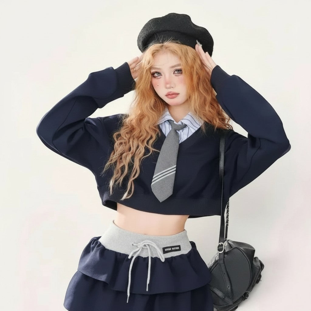 Vusy Kawaii Shop Official navy blue polyester blend two-piece set with a cropped long-sleeve sweater and ruffled mini skirt.