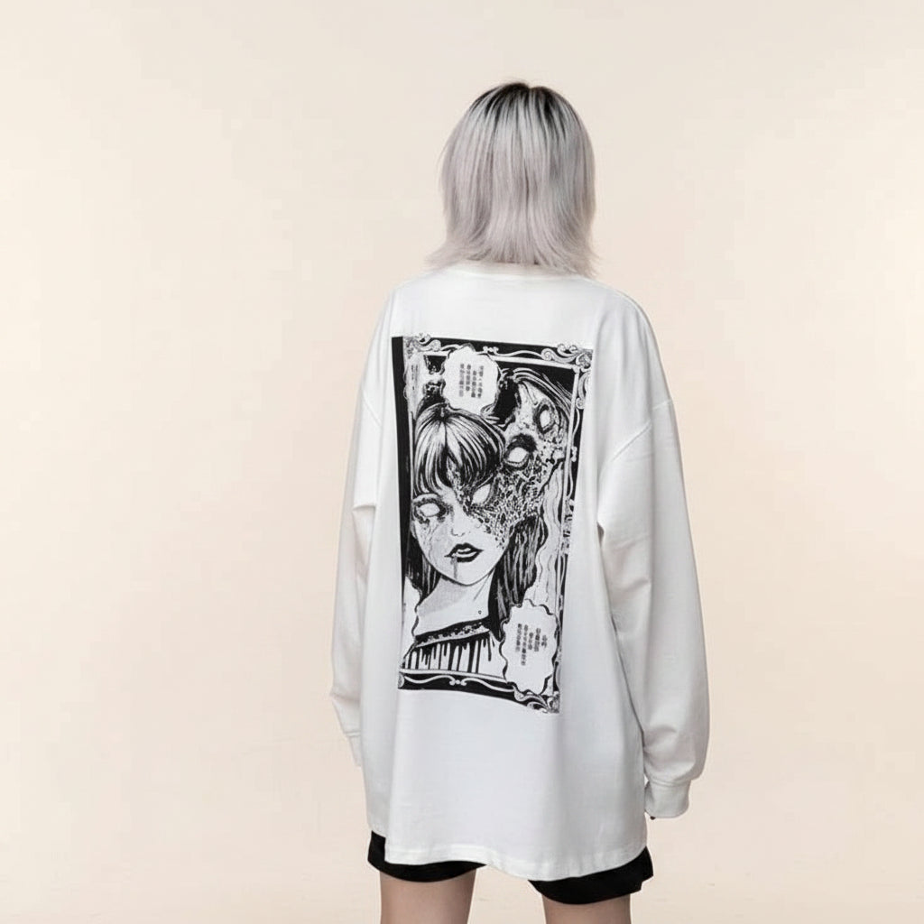 White women's streetwear anime pullover with black manga graphic on back worn by model