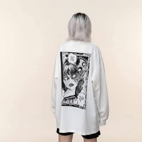 White women's streetwear anime pullover with black manga graphic on back worn by model