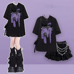 Women's punk plaid skirt set featuring black graphic oversized t-shirt and ruffled mini skirt with chains