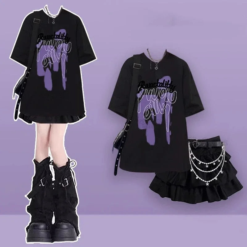 Women's punk plaid skirt set featuring black graphic oversized t-shirt and ruffled mini skirt with chains
