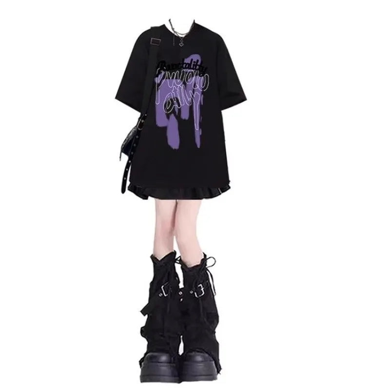 Women's punk plaid skirt set featuring black graphic oversized top and black platform boots