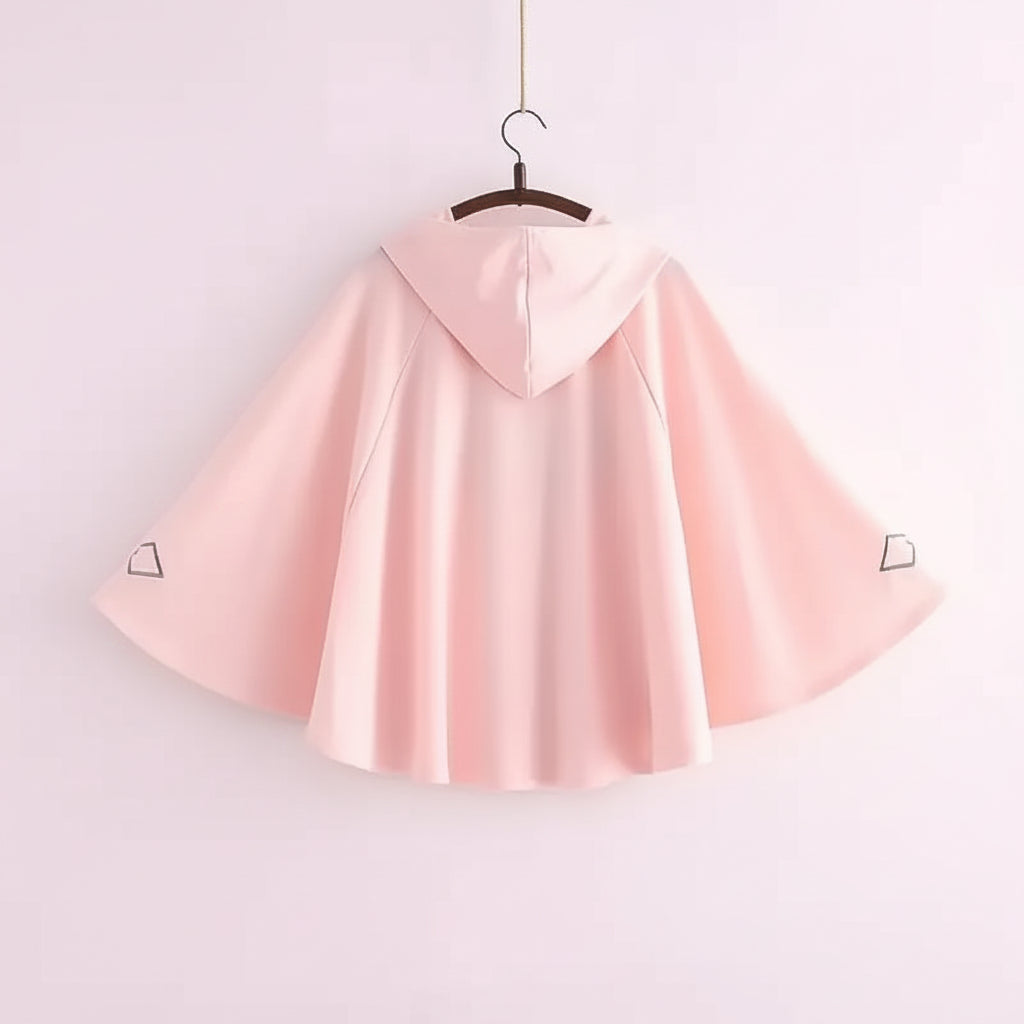 Pink women's spring autumn cute sweatshirt with wide sleeves and hood hanging on a hanger