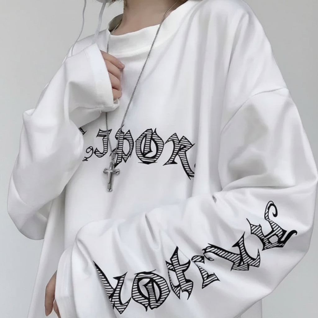 White women's streetwear anime pullover with black gothic text design on front and sleeve
