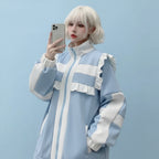 Casual layered coat for girls in light blue and cream with ruffle details and zip front