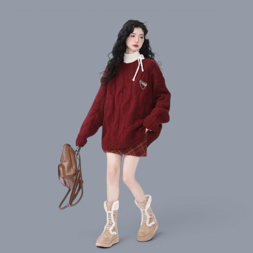 Women modeling cozy chunky knit cute style sweater women in deep red with brown plaid skirt and beige boots