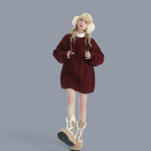 Woman wearing cozy chunky knit cute style sweater women in deep red paired with earmuffs and boots