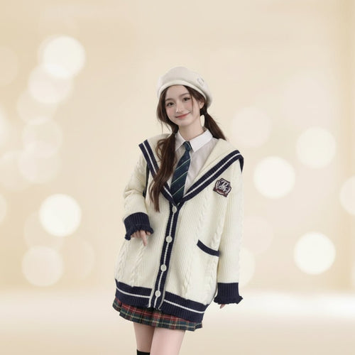 Young woman wearing oversized knit cute sweater coat for women in a cozy cafe setting