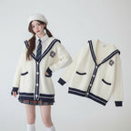 Oversized knit cute sweater coat for women in white with navy trim and button closure