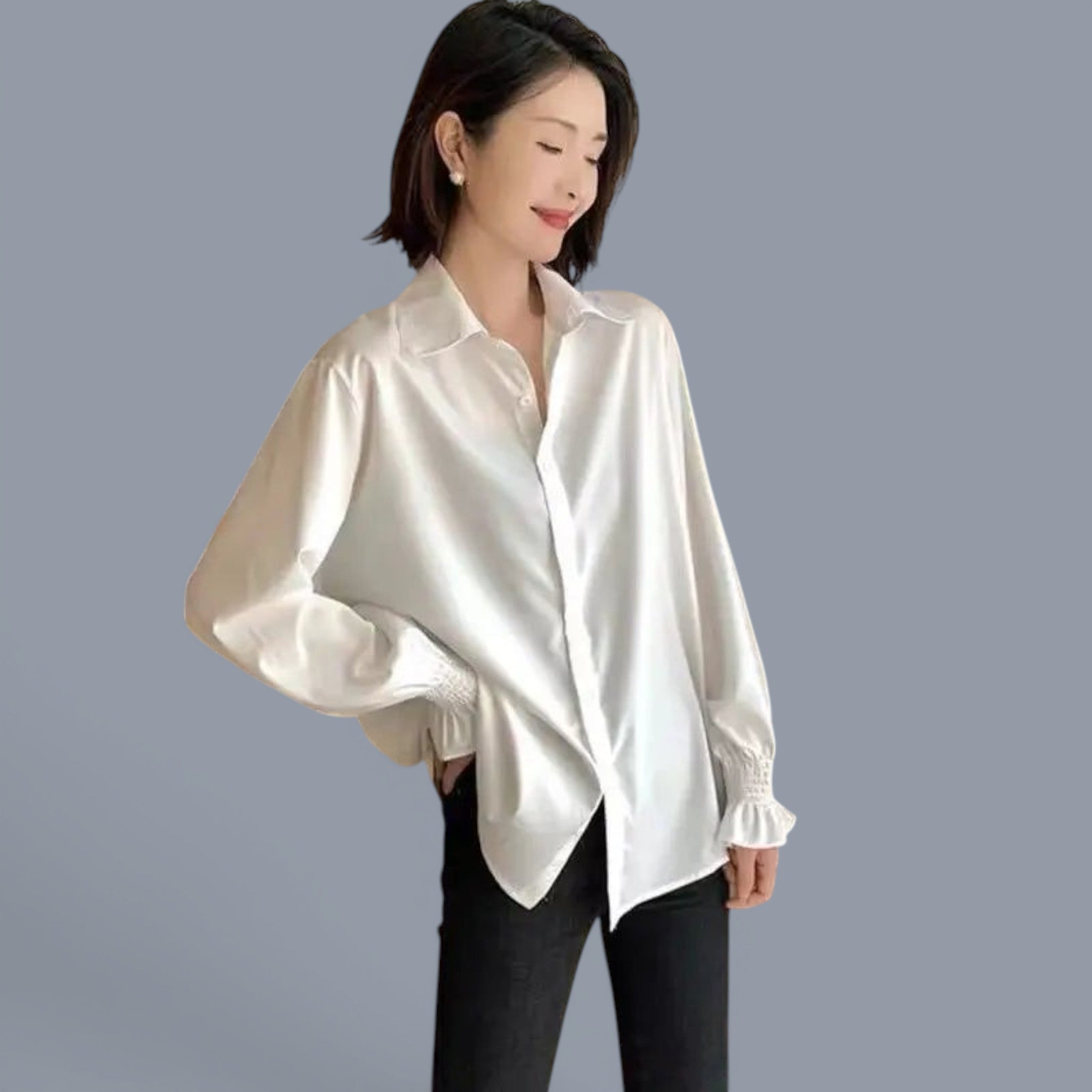 Woman wearing cozy chunky knit cute style sweater women in white with long sleeves and black pants